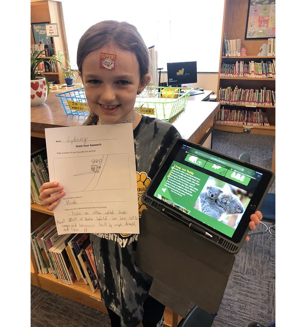 PES student Sydney K. researches koalas for a Library project.